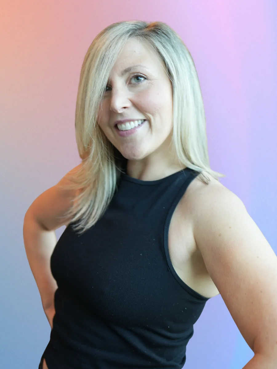 Portrait of Daniela, guide and DJ, smiling in a black top